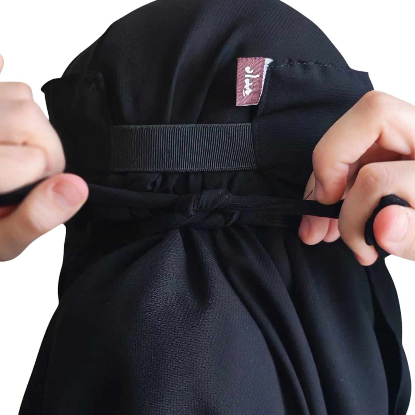 Niqab, voile et élastique